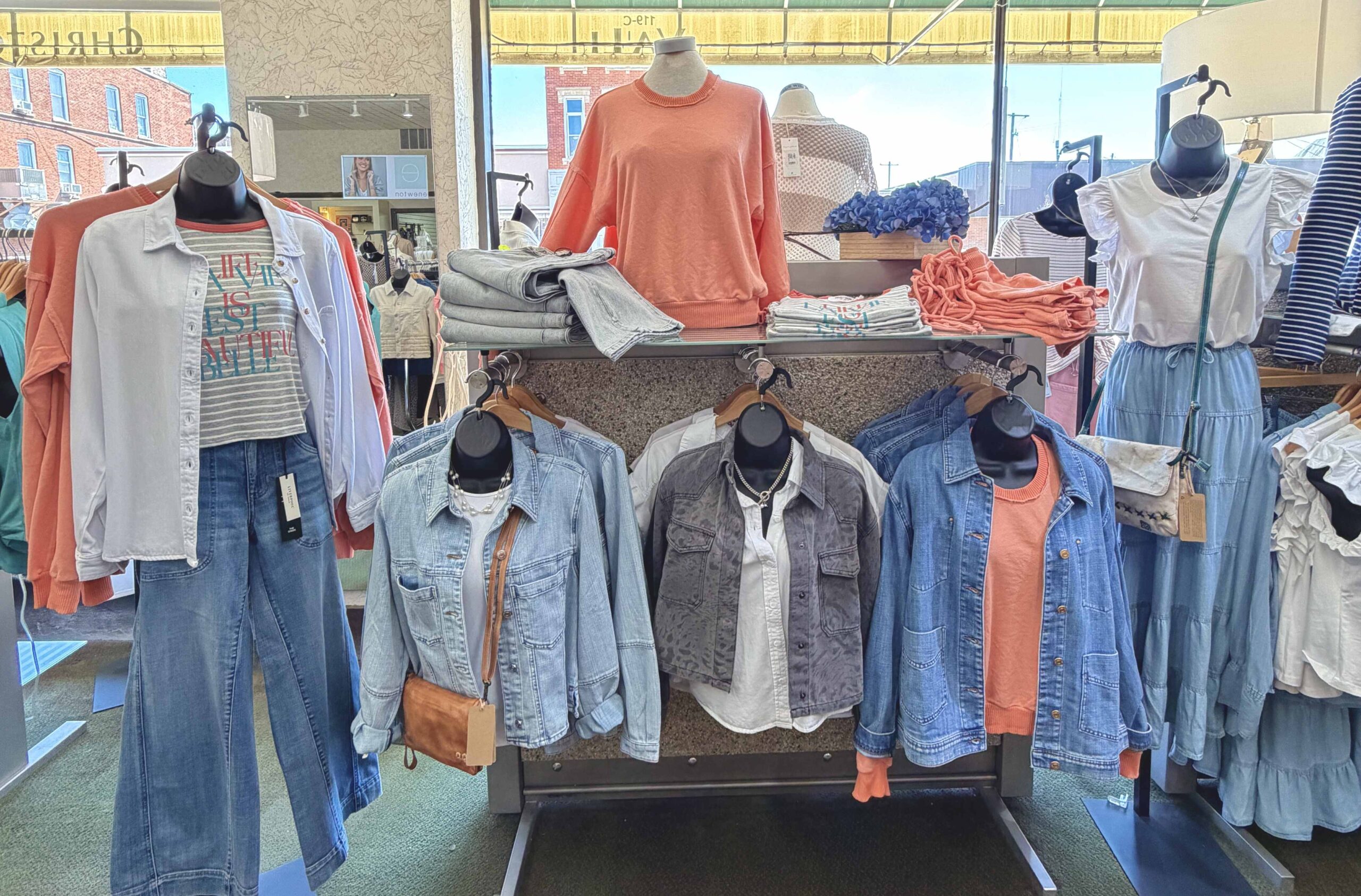 Boutique store display with casual womens clothes including jeans, danim, shirts, tops, and blouses. Christopher's Boutique Circleville OH